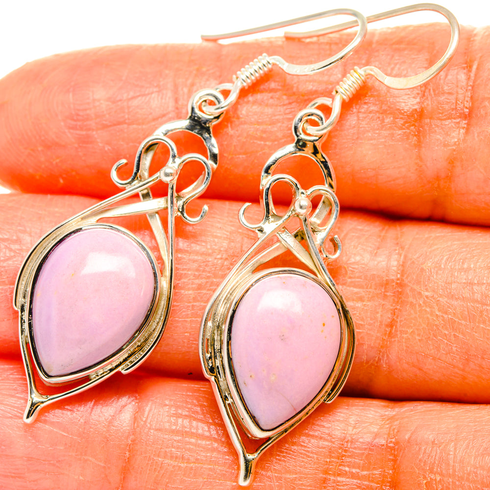 Close-up of pink oval phosphosiderite earrings in sterling silver with ornate frames