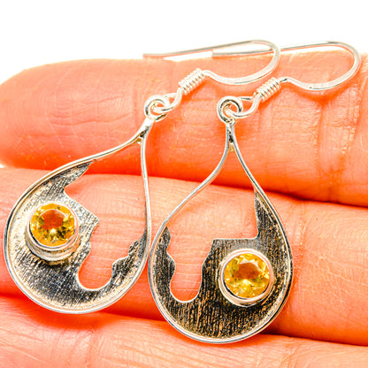 Sterling silver citrine drop earrings with round yellow gemstone in ornate bezel