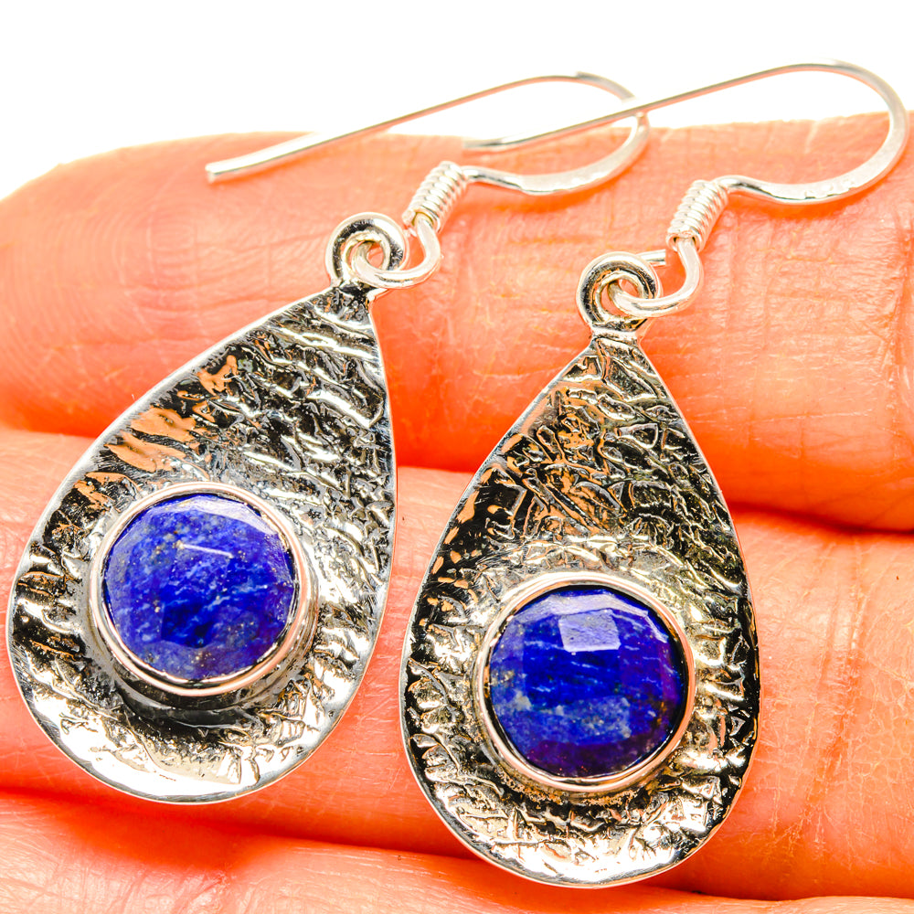 Sterling silver teardrop earrings with blue lapis cabochon and fishhook backs