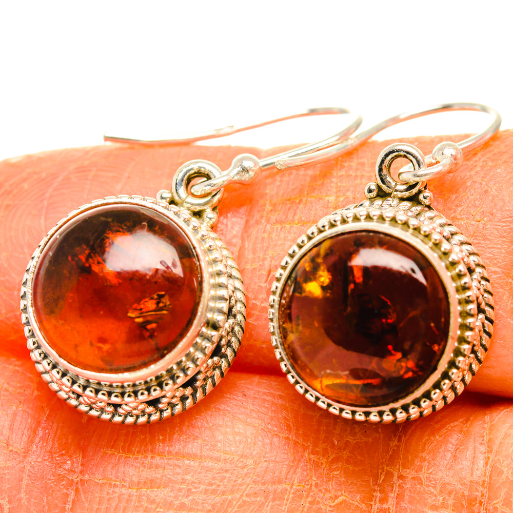 Amber cabochon drop earrings in 925 silver, round orange stones with textured beaded border