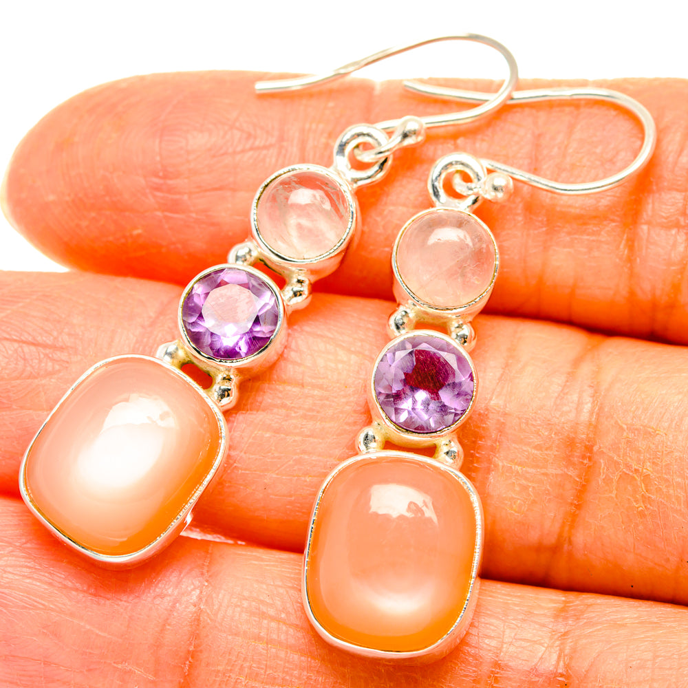 Sterling-silver dangling earrings with peach and purple gemstone with orange drop