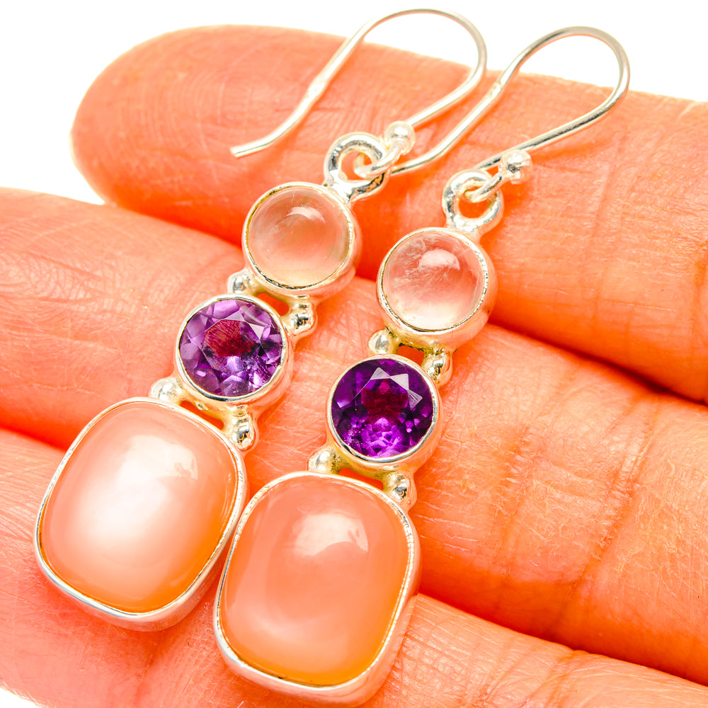 Sterling silver drop earrings with round amethyst and peach-pink oval stones