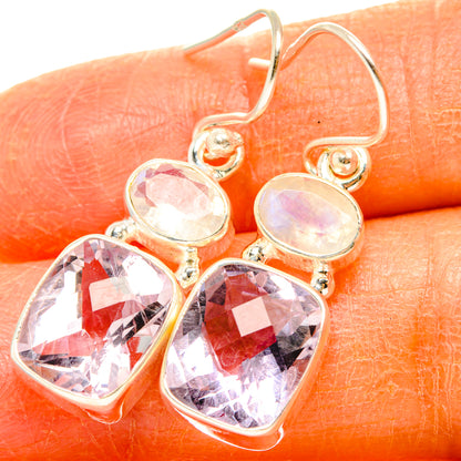 Silver drop earrings with faceted pink-purple and oval rainbow stone accents