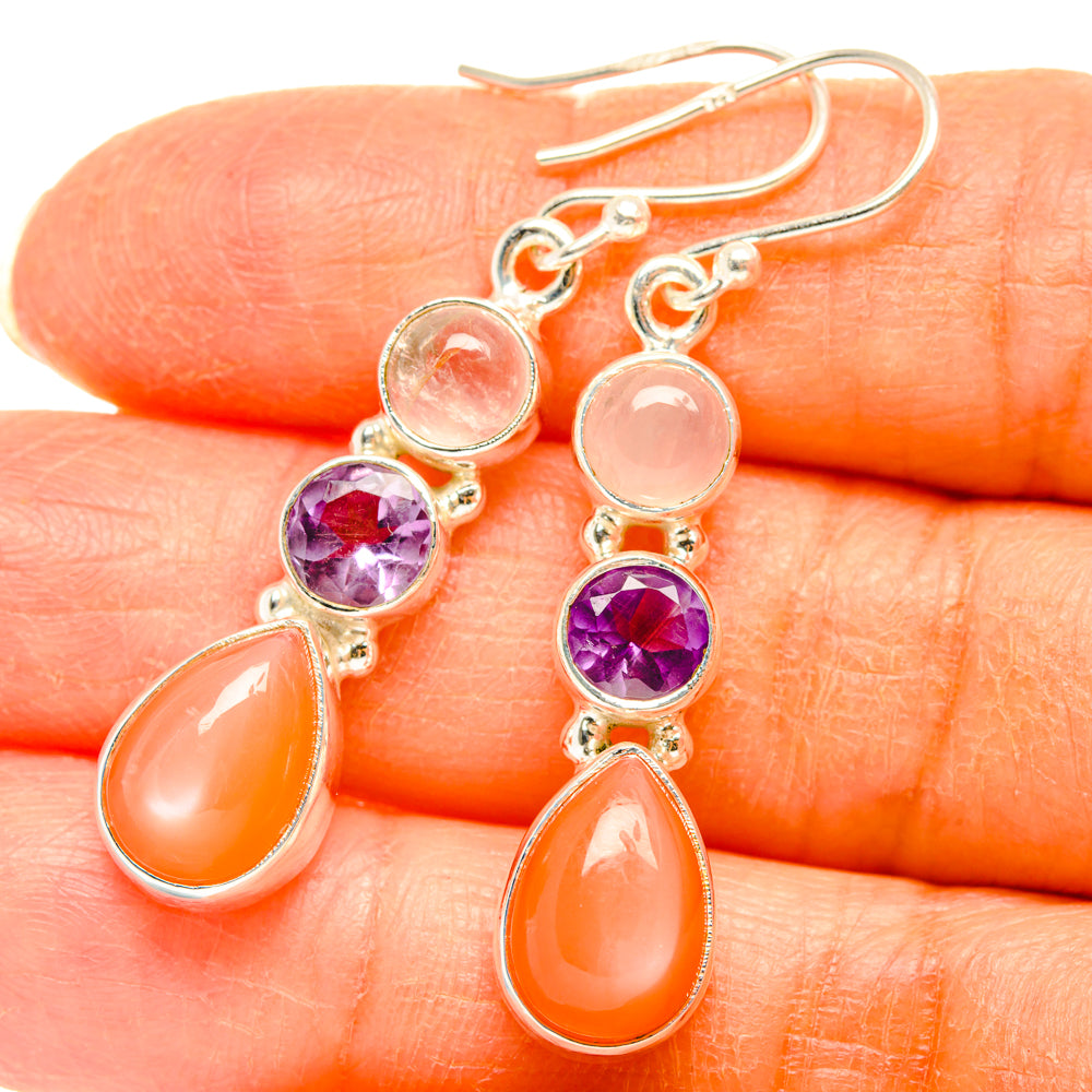 Sterling silver earrings with purple amethyst, peach moonstone, and round pink stones