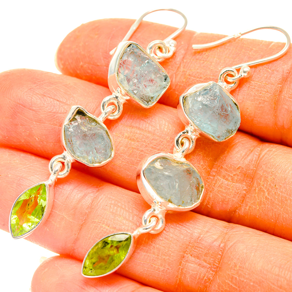 Sterling silver dangle earrings with rough aquamarine and green peridot drop accents