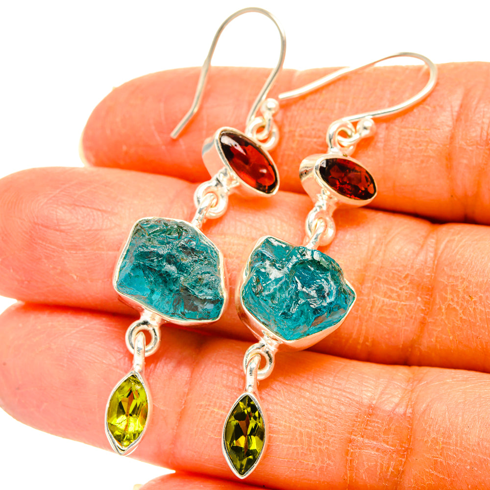 Sterling silver rough-stone drop earrings closeup: blue apatite with red garnet and green peridot