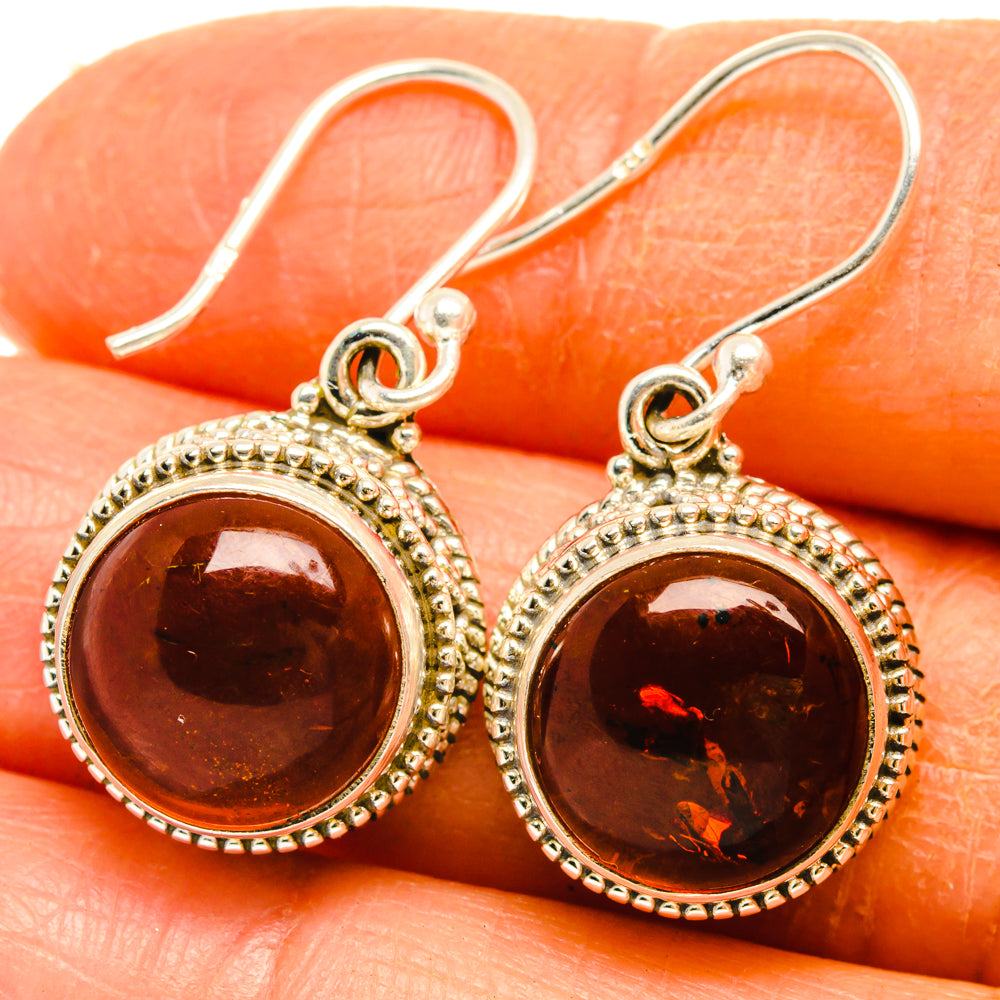 Sterling silver amber drop earrings with dark brown round cabochon and halo border
