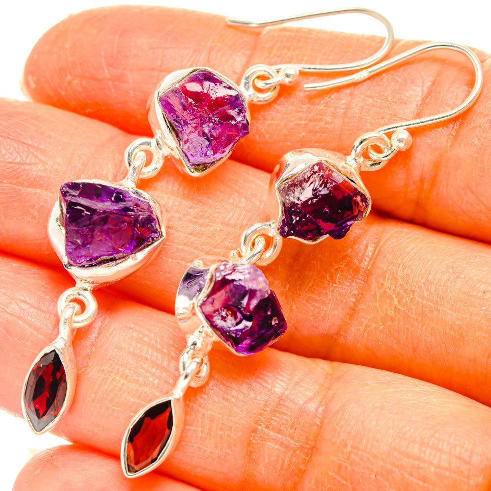 Sterling silver earrings with rough purple amethyst-style stones and maroon teardrop accents