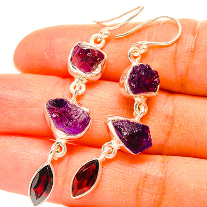 925 silver amethyst and garnet drop earrings close-up, purple rough stones and red faceted drops