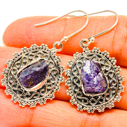 Rough tanzanite drop earrings, oval silver frame with purple stone, French hooks