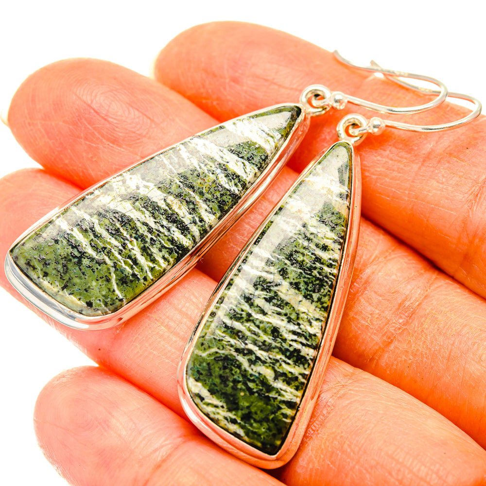 Green Swiss opal teardrop earrings close-up on silver hooks, 925 sterling silver