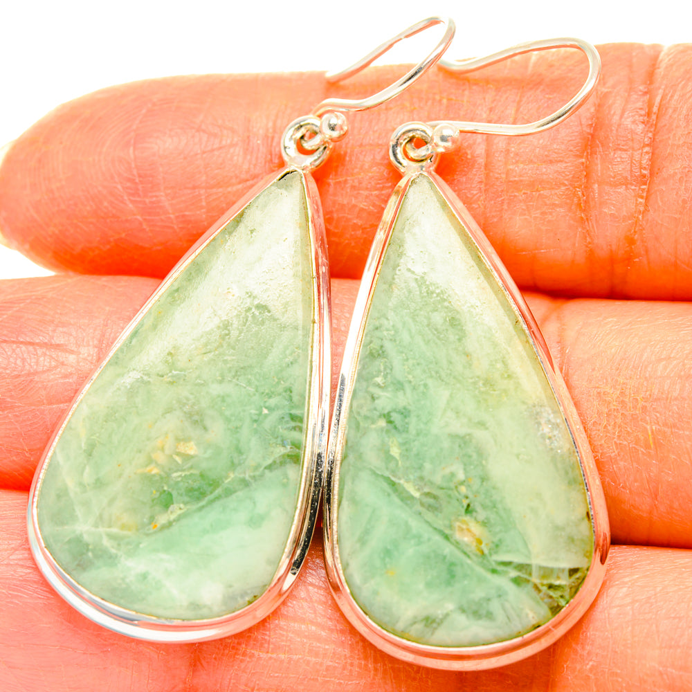 Teardrop green gemstone drop earrings, 925 sterling silver, detailed close-up.