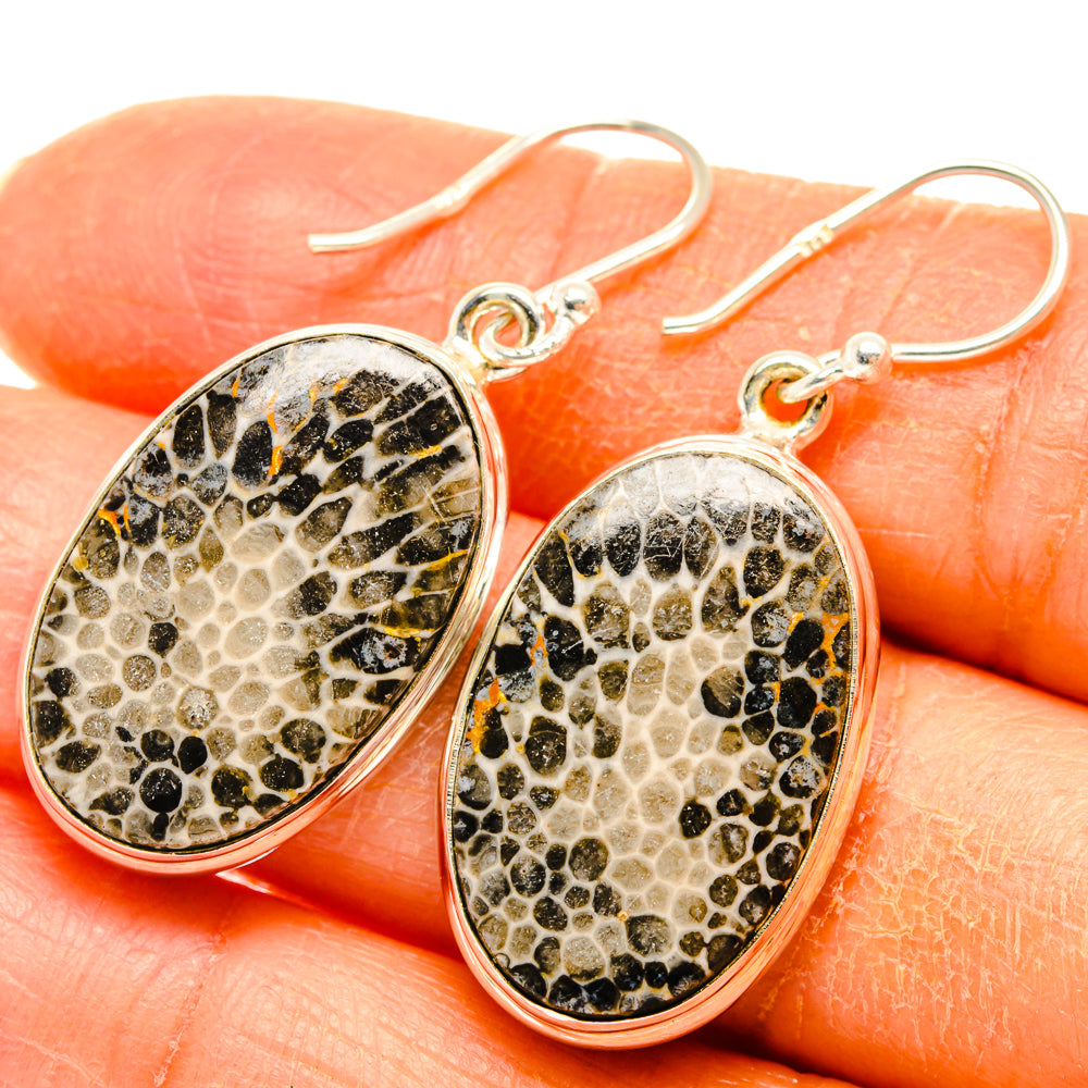 Oval sterling silver drop earrings with speckled beige-and-black coral-pattern stone