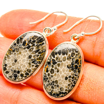 Oval sterling silver drop earrings with speckled beige-and-black coral-pattern stone