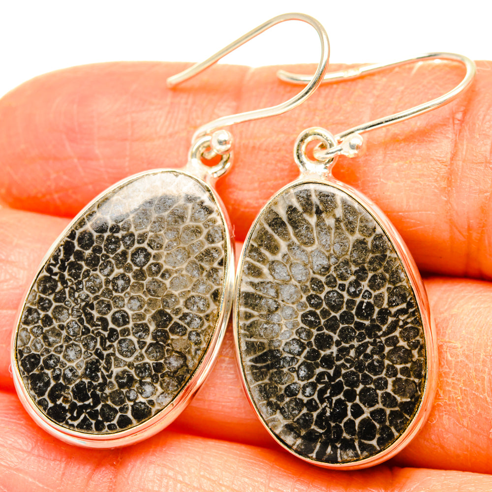 925 sterling silver oval drop earrings with black speckled stingray coral texture.