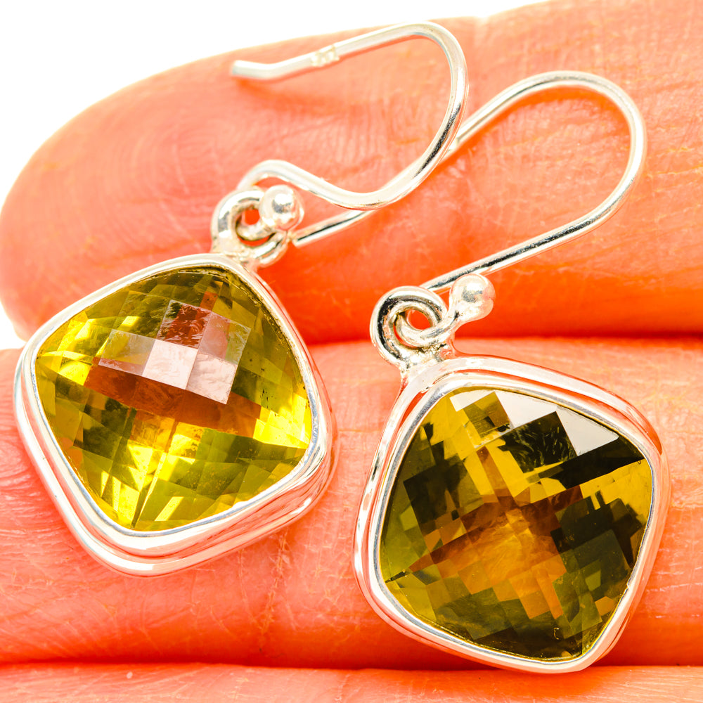 Sterling silver hook earrings with large faceted green-yellow citrine teardrop stones