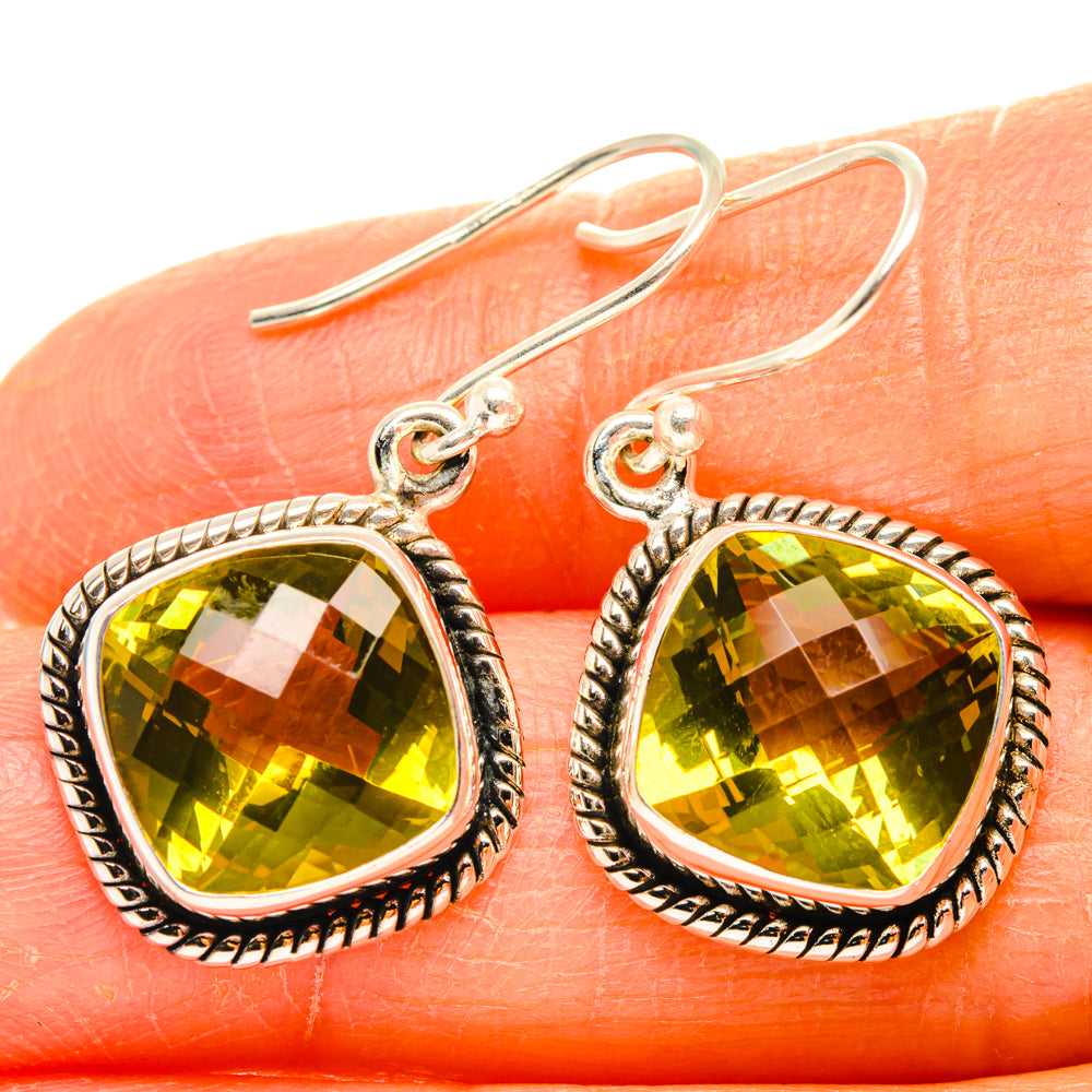 Sterling silver lemon quartz pear earrings with teardrop faceted yellow-green stones