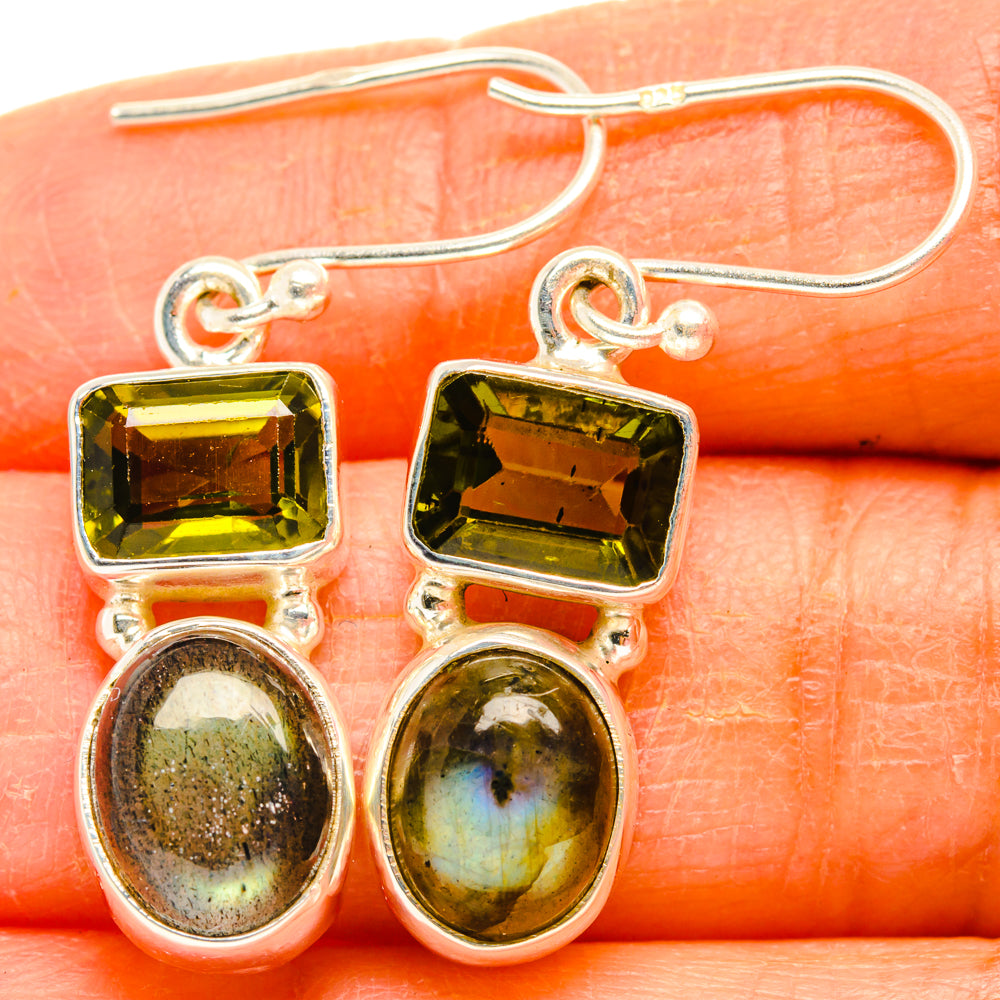 925 sterling silver drop earrings close-up with square green stones and oval iridescent dangles