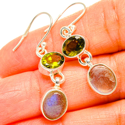 925 sterling silver earrings with round green peridot stones and iridescent oval drops