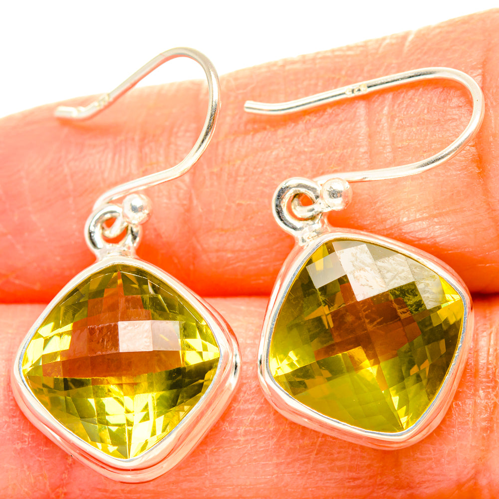Sterling silver drop earrings with faceted lemon quartz teardrop stones, yellow-green.