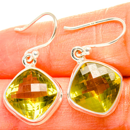 Sterling silver drop earrings with faceted lemon quartz teardrop stones, yellow-green.