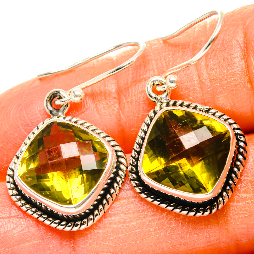 Sterling silver teardrop quartz earrings with rope border and yellow-green faceted stones