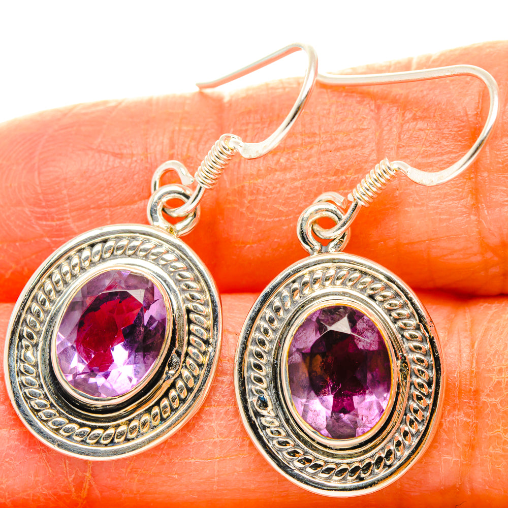 Silver amethyst drop earrings with faceted oval stones in ornate round bezel