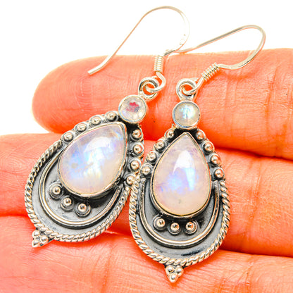 Teardrop moonstone dangle earrings in 925 sterling silver, close-up ornate silverwork