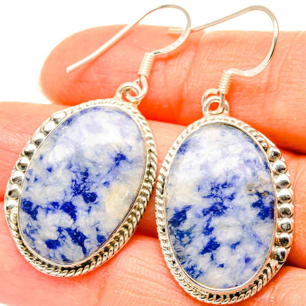 Sodalite oval drop earrings, blue marbled stone set in 925 sterling silver bezel on hand