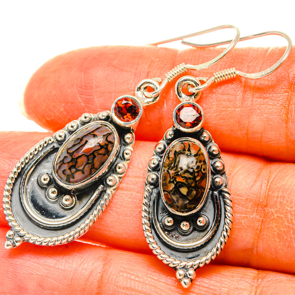 Garnet dinosaur bone earrings on oval stone settings, red round accents in silver