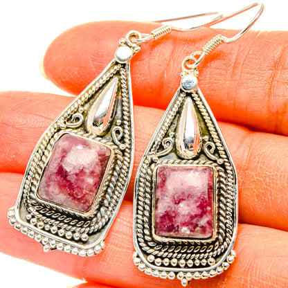 Sterling silver teardrop earrings with pink gemstone and ornate filigree