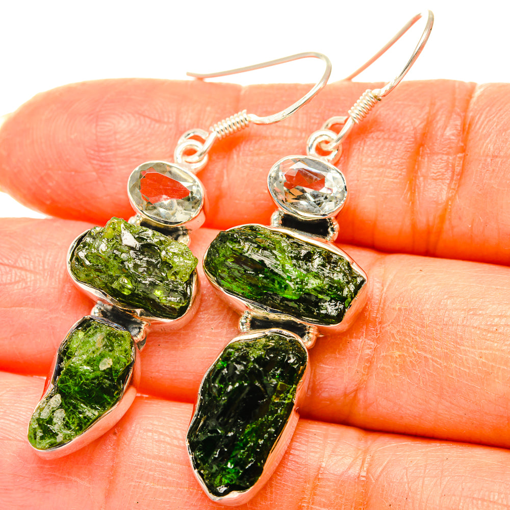 Sterling silver drop earrings with rough green stone and clear faceted top