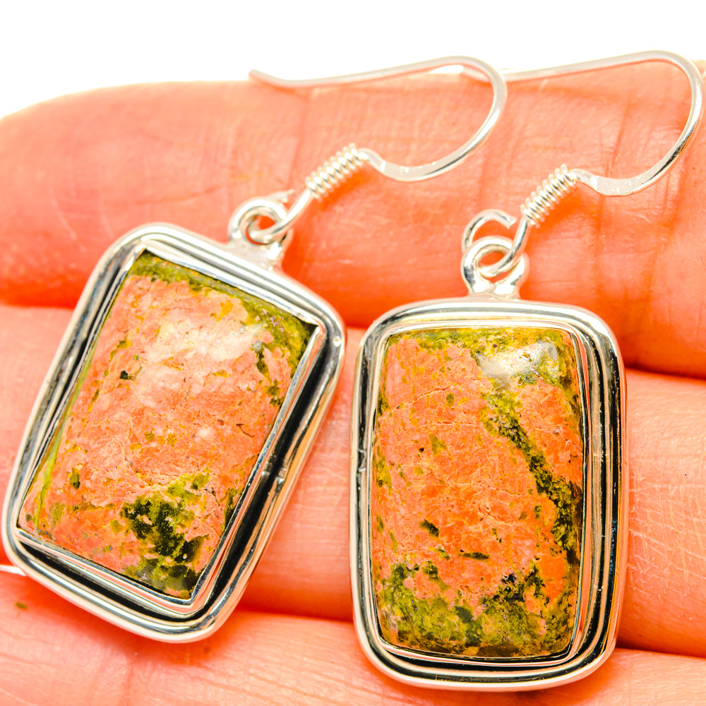 Unakite stone dangle earrings, square cabochons in silver frames, close-up on hooks