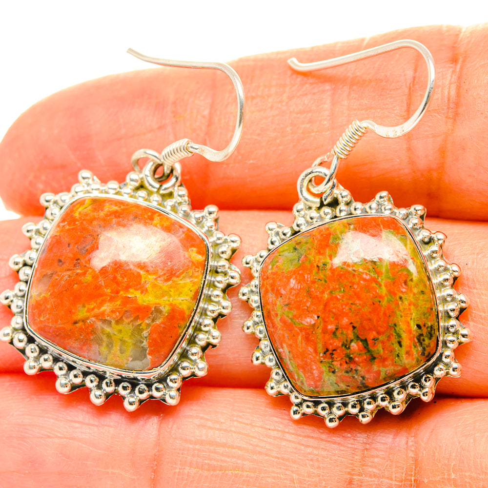 Orange unakite cabochon drop earrings with silver filigree border and hook backs