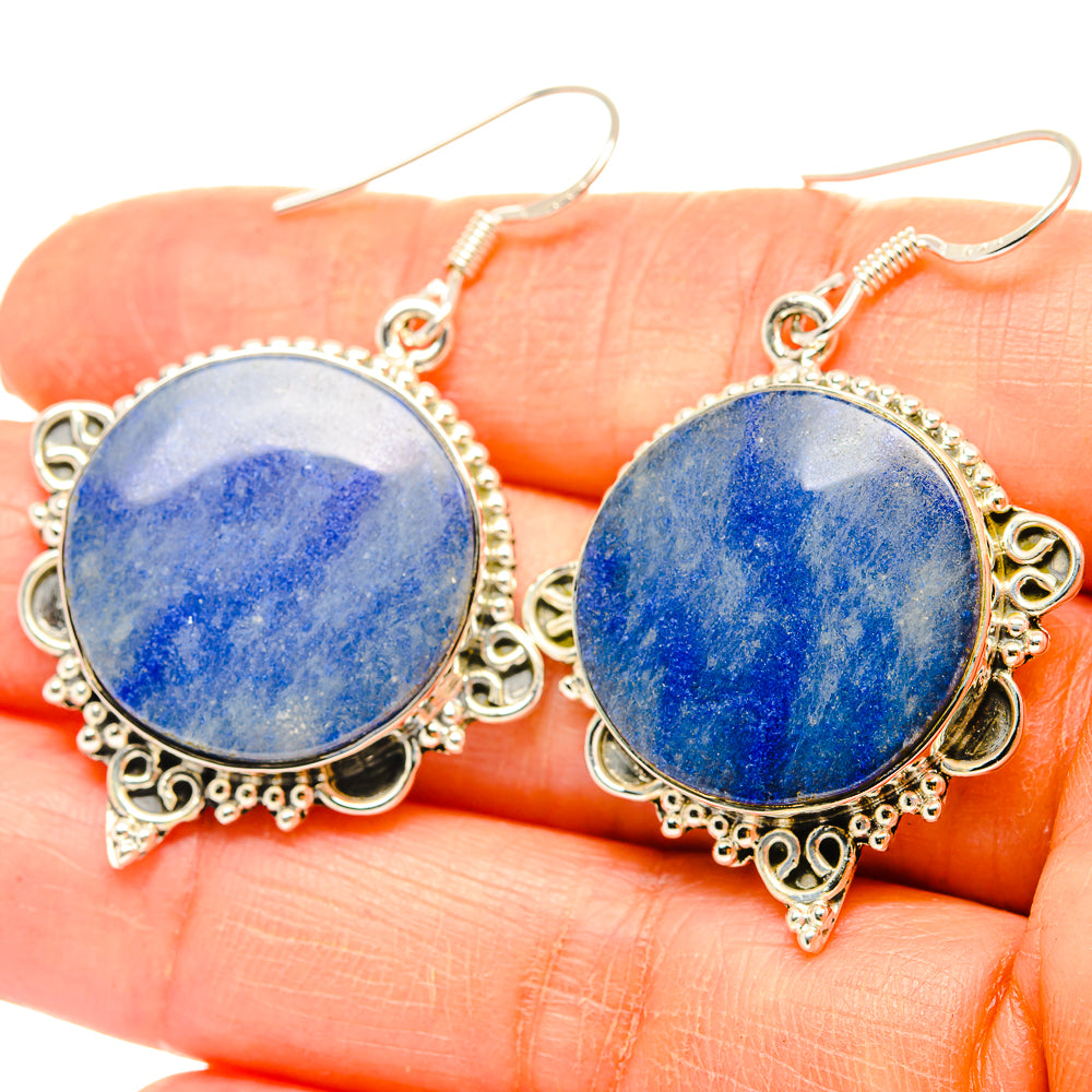 Round blue sodalite dangle earrings with ornate silver-tone frame and fishhook ear wires
