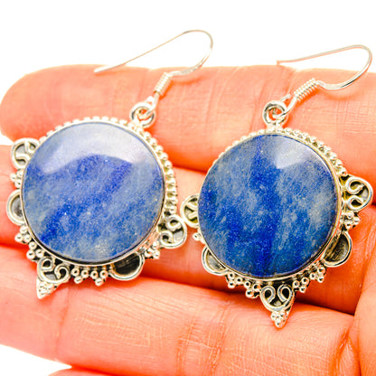 Round blue sodalite dangle earrings with ornate silver-tone frame and fishhook ear wires