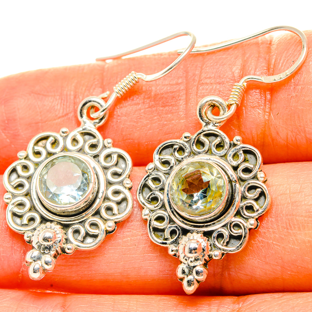 Round blue-green gemstone drop earrings with ornate silver filigree and hooks