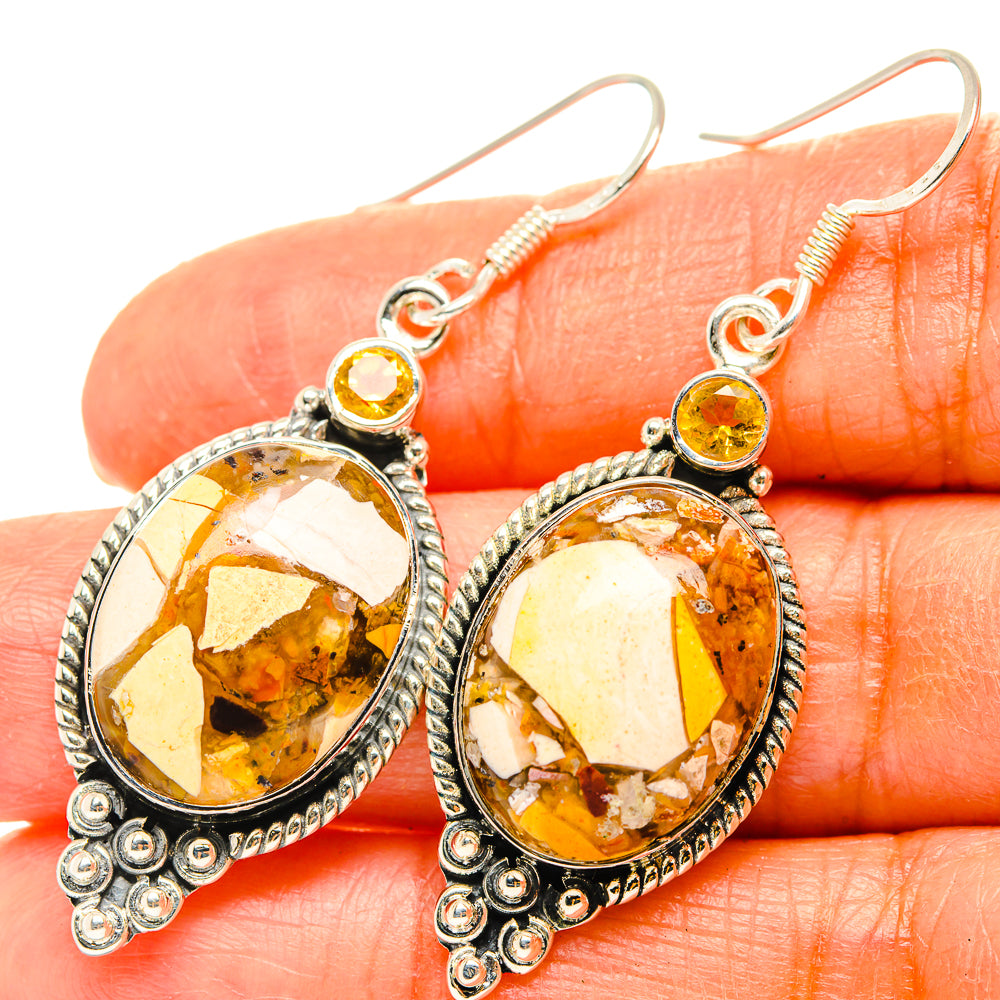 Sterling silver drop earrings with oval amber-yellow stone and round top citrine accents