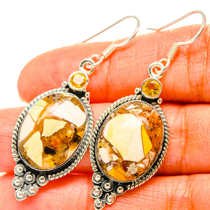 Sterling silver drop earrings with oval amber-yellow stone and round top citrine accents