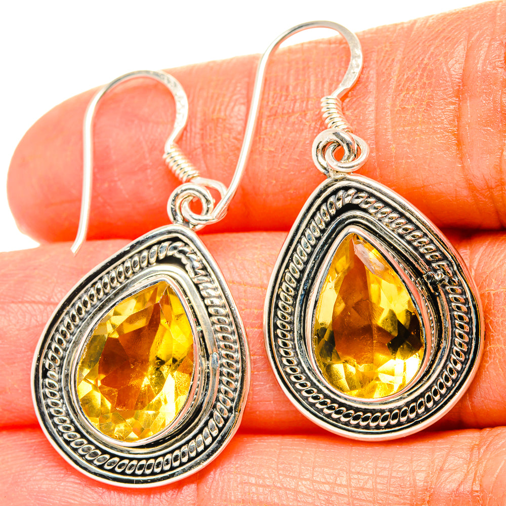 Sterling silver teardrop earrings with faceted citrine gemstones and beaded edge trim