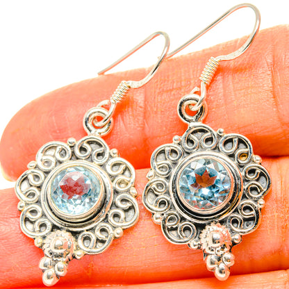 Blue topaz drop earrings in sterling silver with ornate round filigree and dangling beads