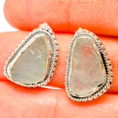 Rough aquamarine teardrop earrings in 925 sterling silver with braided rope border