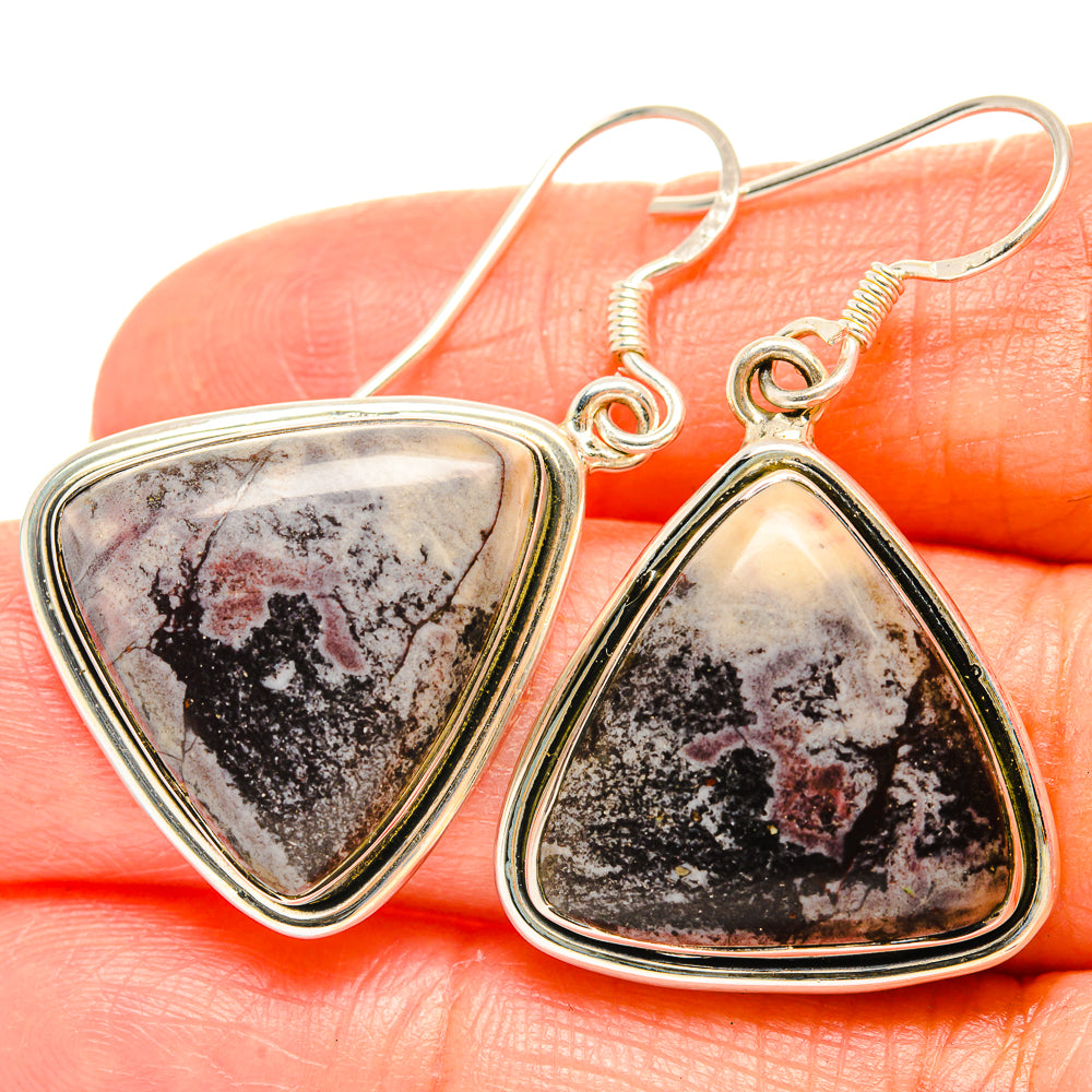 Side-by-side 925 sterling silver fishhook earrings with teardrop marbled jasper cabochon