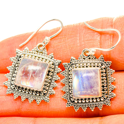 Sterling silver square moonstone earrings with iridescent rainbow sheen, detailed bezel