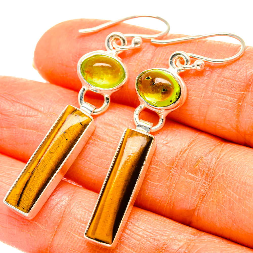 Sterling silver drop earrings with green peridot cabochons and amber tiger-eye bars