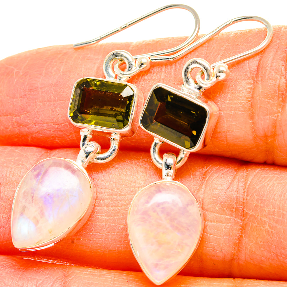 Sterling silver earrings with dark green square stones and opalescent pink teardrop dangles