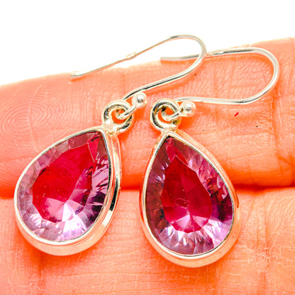 Teardrop faceted gemstone earrings with pink-red stones in silver frames