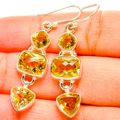 Sterling silver faceted citrine drop earrings with four dangling yellow gems