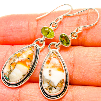 Sterling silver dangle earrings with green peridot drops and teardrop spiny oyster inlay