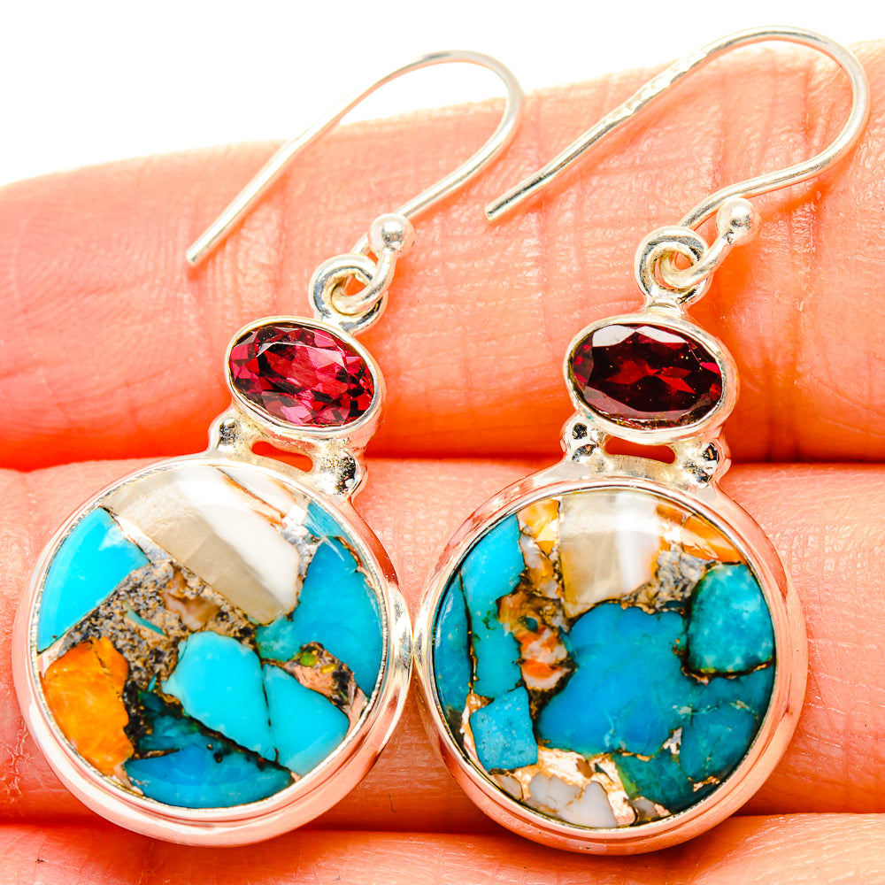 Sterling silver earrings with oval turquoise stone drops and red garnet accents